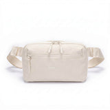 Zeeksack Crossbody Organizer (hiekanbeige) – olkahihna ja vetoketjullinen etutasku.